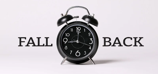 image of a black "old-school" alarm clock with the words "Fall" and "Back" on either side of it
